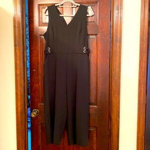 PXL black one piece jumpsuit. With silver hardware in the front and back.